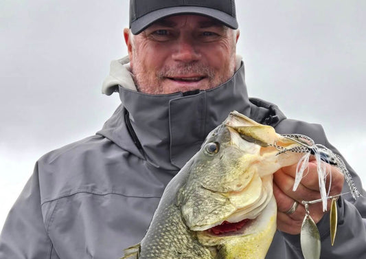 Spinnerbait fishing for bass using a tandem blade spinnerbait in shallow water conditions